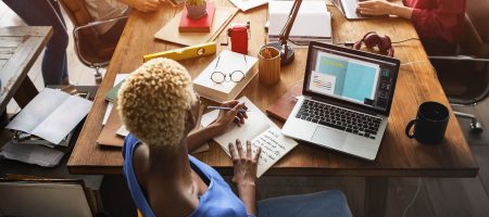 Woman at conference room table with computer