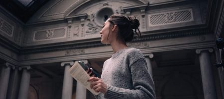 Portrait of a young attractive woman visiting museum or gallery